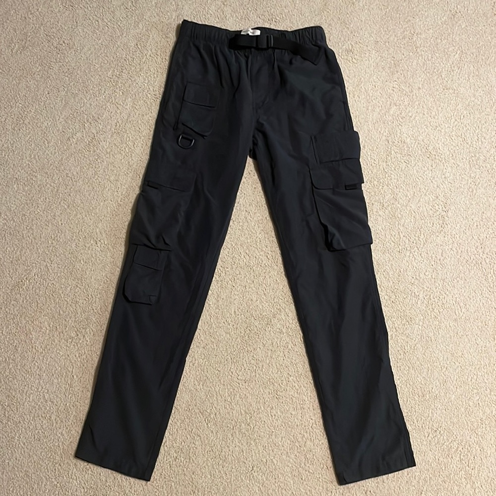 Black cargo pants with belt and pockets. Trendy